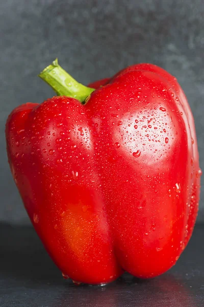 Red sweet pepper on a slate — Stock Photo, Image