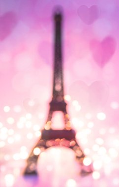 Sevgililer Günü özeti Eiffel kulesi pembe arka planda, kalpleri ve ışıkları olan.