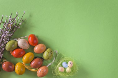 Easter and spring still life. Various easter eggs and bouquet of willow
