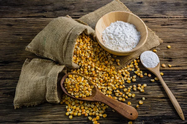 Corn flour and dried corn on a wooden table old. — Stock Photo, Image