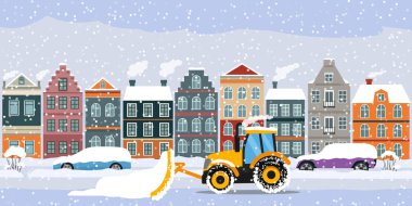 A tractor cleans the road in the city after heavy snow and hail.