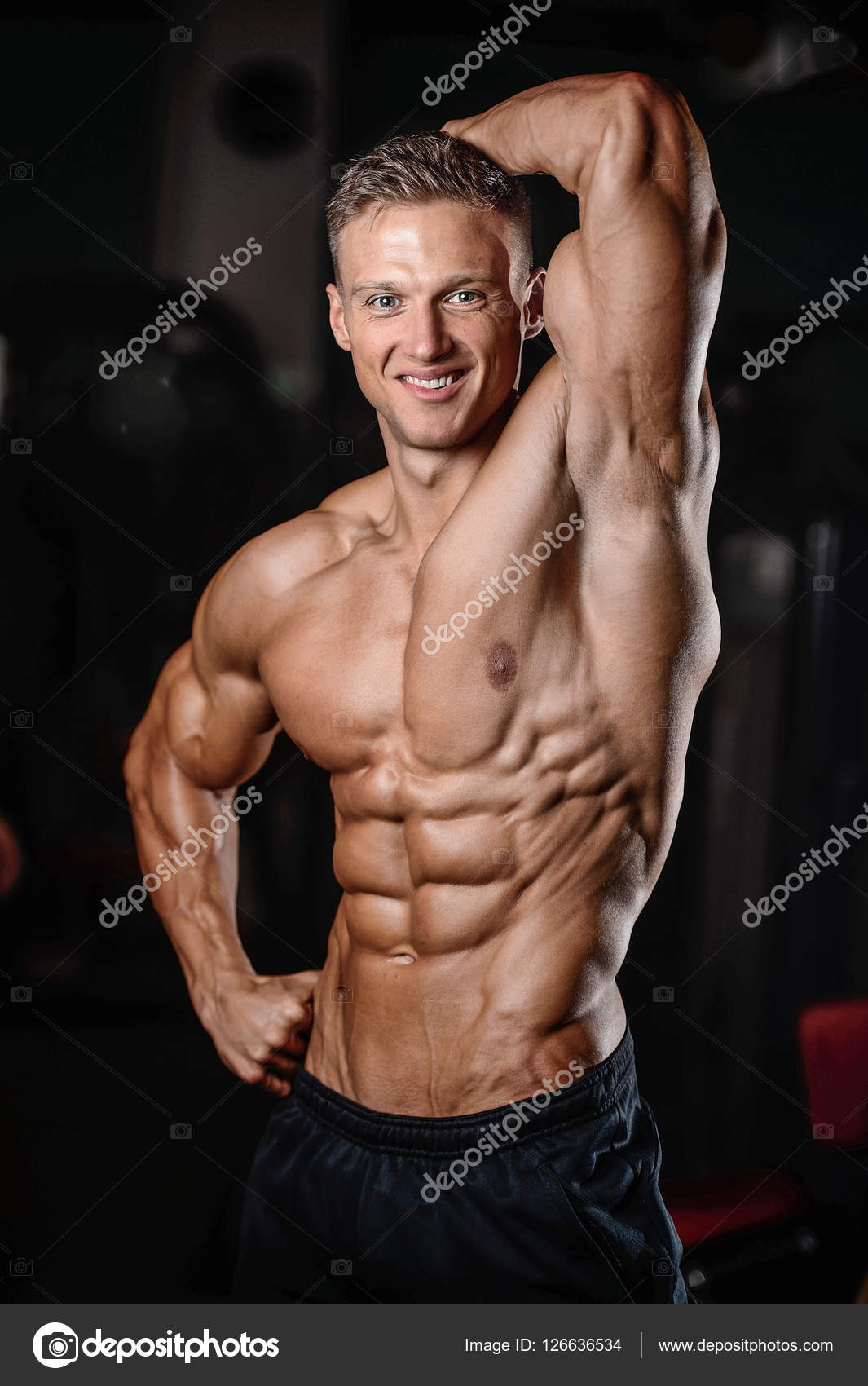 Strong athletic man fitness model showing six pack abs Stock Photo by  ©antondotsenko 126635864
