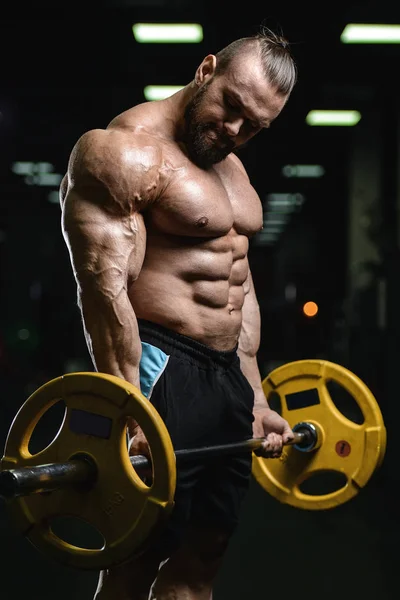 Brutale starke Bodybuilder athletische Männer, die Muskeln mit d aufpumpen — Stockfoto