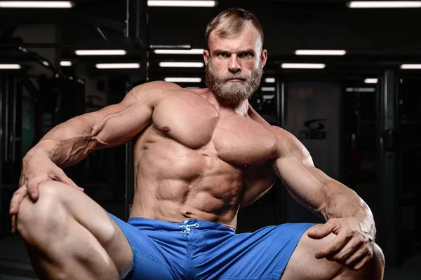 Brutal muscular man with beard unshaven fitness model healthcare — Stock Photo, Image