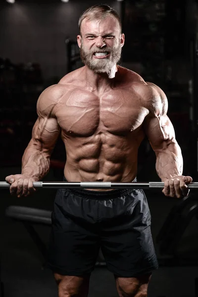 Brutal muscular man with beard unshaven fitness model healthcare — Stock Photo, Image