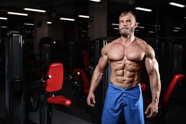 Brutal muscular man with beard unshaven fitness model healthcare — Stock Photo, Image
