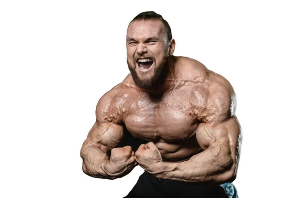 Handsome fit caucasian muscular man flexing his muscles in gym — Stock Photo, Image