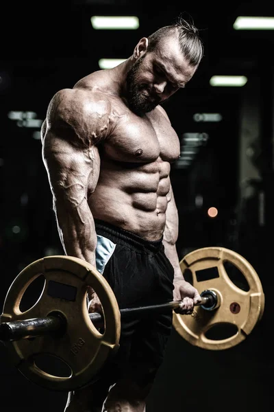Guapo poder atlético hombre en la dieta de entrenamiento bombeo de los músculos — Foto de Stock