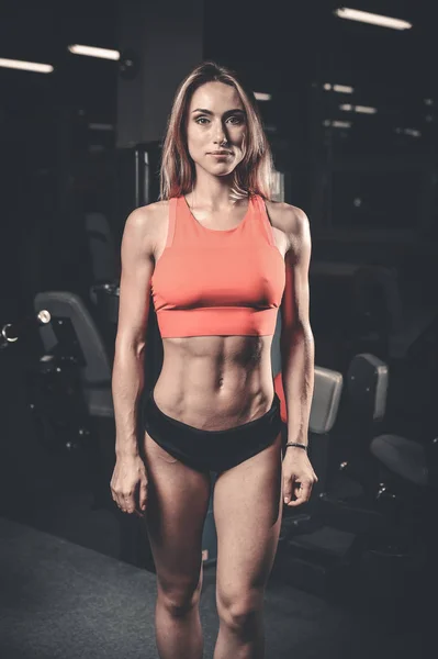 Caucasian sexy fitness female model in gym close up ab — Stock Photo, Image