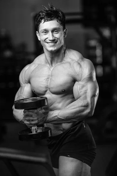 Handsome power athletic man on diet training pumping up muscles — Stock Photo, Image