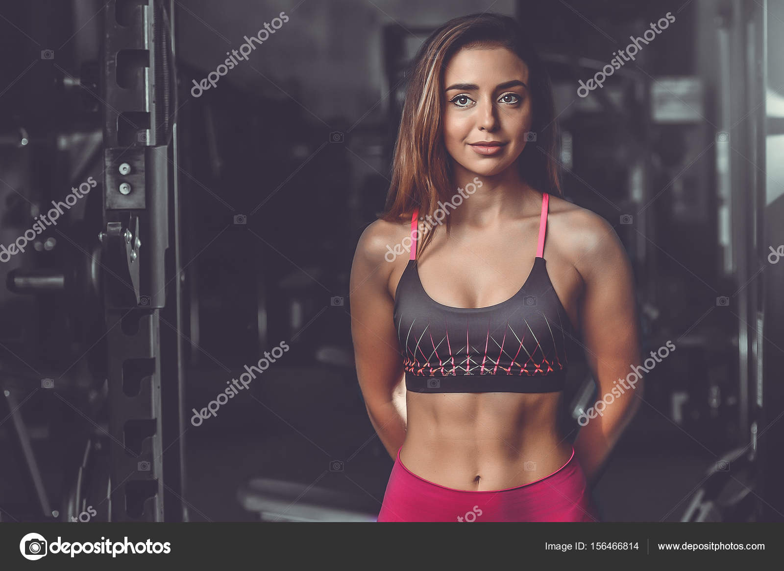 Caucasian sexy fitness female model in gym close up ab Stock Photo