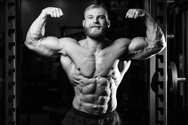 Handsome power athletic man on diet training pumping up muscles — Stock Photo, Image