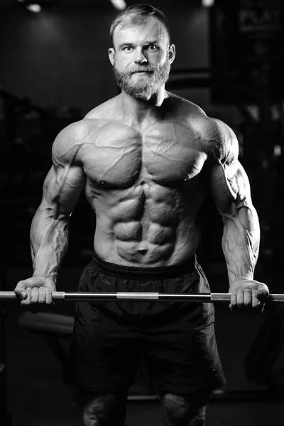 Handsome power athletic man on diet training pumping up muscles — Stock Photo, Image