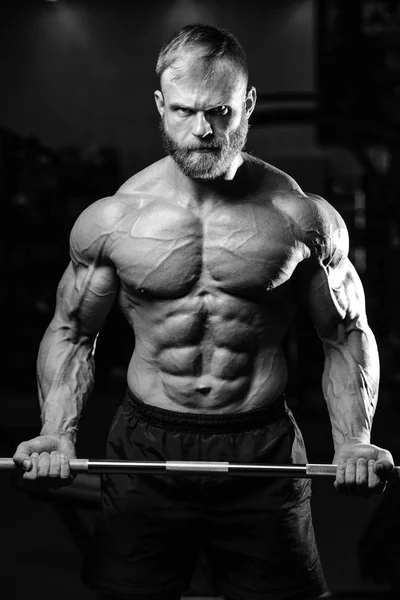 Handsome power athletic man on diet training pumping up muscles — Stock Photo, Image