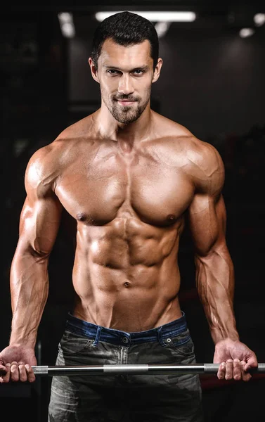 Handsome power athletic man on diet training pumping up muscles — Stock Photo, Image