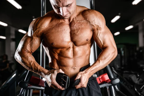 Brutal bodybuilder powerful training arms, pectorals and shoulde