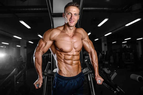 Strong athletic man fitness model showing six pack abs Stock Photo by  ©antondotsenko 126635864