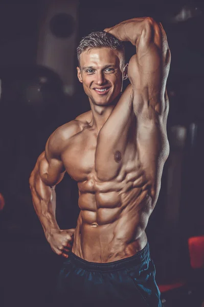 Caucasian sexy fitness model in gym close up ab — Stock Photo, Image