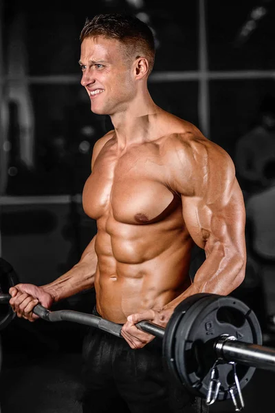 Handsome power athletic man on diet training pumping up muscles — Stock Photo, Image