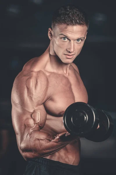 Handsome power athletic man on diet training pumping up muscles — Stock Photo, Image