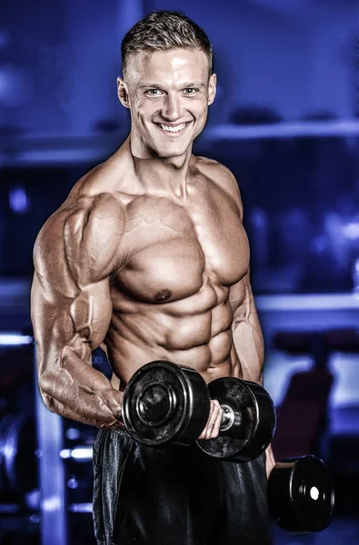 Handsome power athletic man on diet training pumping up muscles — Stock Photo, Image