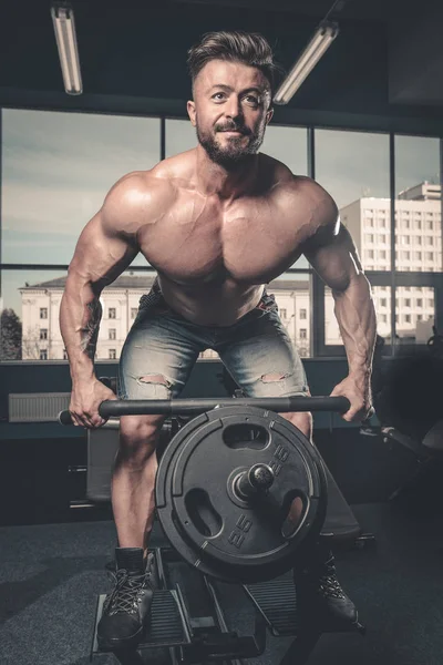 Handsome power athletic man diet training pumping up back muscle