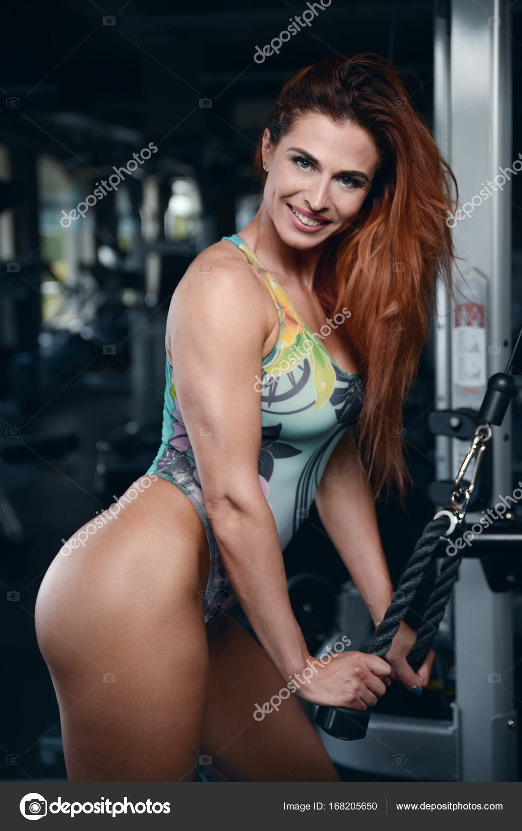 Sexy athletic young girl working out in gym Stock Photo by ©antondotsenko 168205650 photo