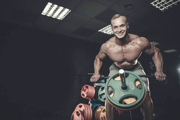 Attractive model young man training in gym — Stock Photo, Image