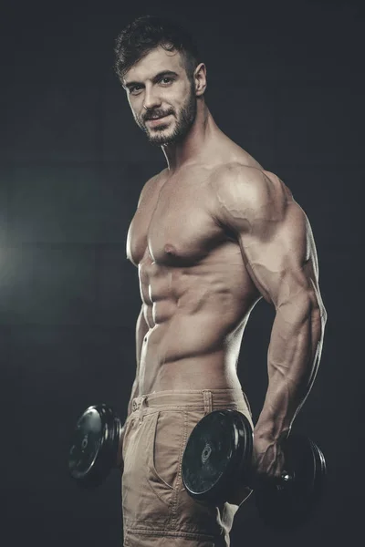 Attractive model young man training in gym — Stock Photo, Image