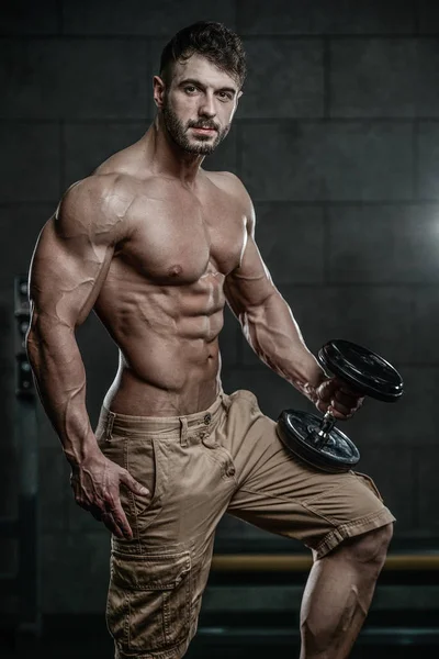 Attractive model young man training in gym — Stock Photo, Image