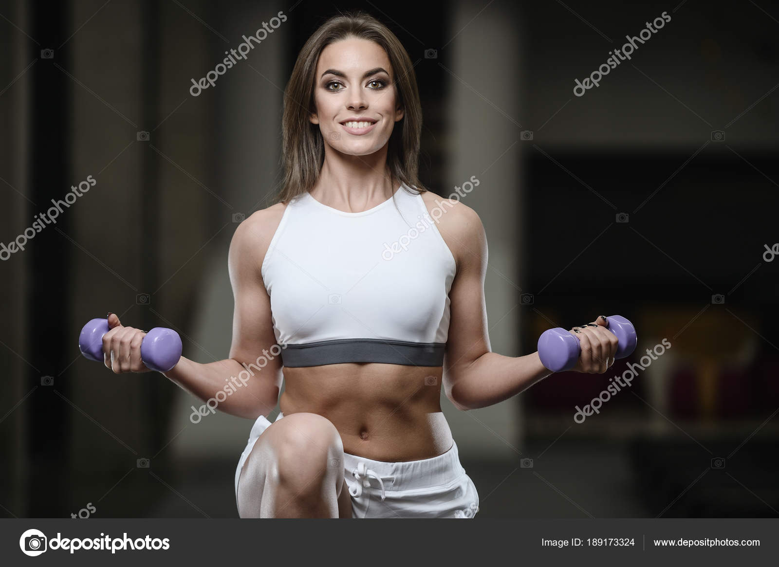Strong Sexy Athletic Young Girl Working Out In Gym Stock Photo C Antondotsenko