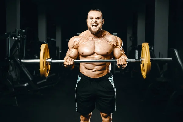 Vücut Geliştirici Yakışıklı Güçlü Atletik Sert Adam Kaslarını Şişiriyor Kaslarını — Stok fotoğraf