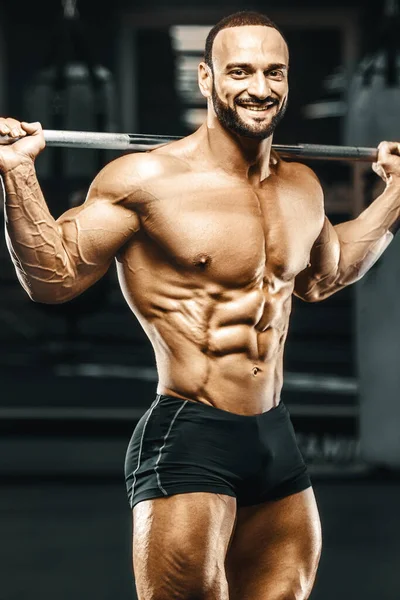 Man Pompt Beenspieren Workout Fitness Bodybuilding Concept Sportschool Achtergrond Oefeningen — Stockfoto