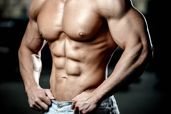 Strong athletic man fitness model showing six pack abs Stock Photo by  ©antondotsenko 126635864