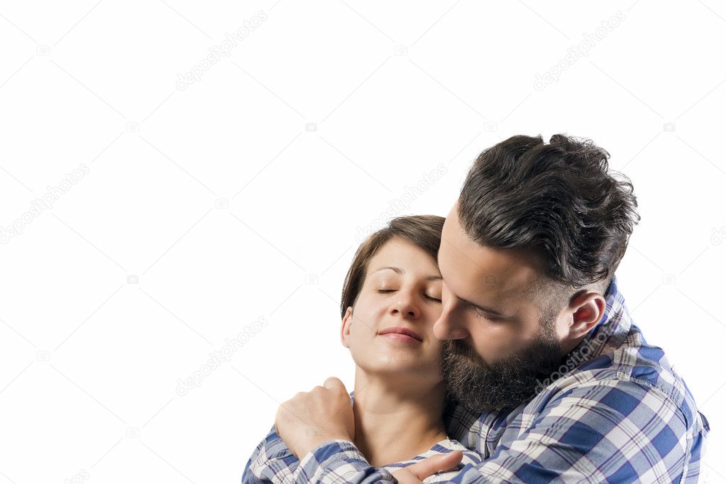 Embrace of bearded guy and girl