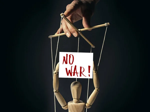 Puppet with a banner "no war" — Stock Photo, Image