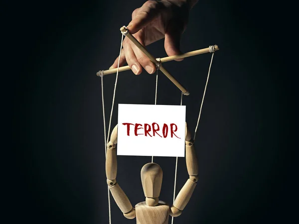 Puppet with a banner "terror" — Stock Photo, Image