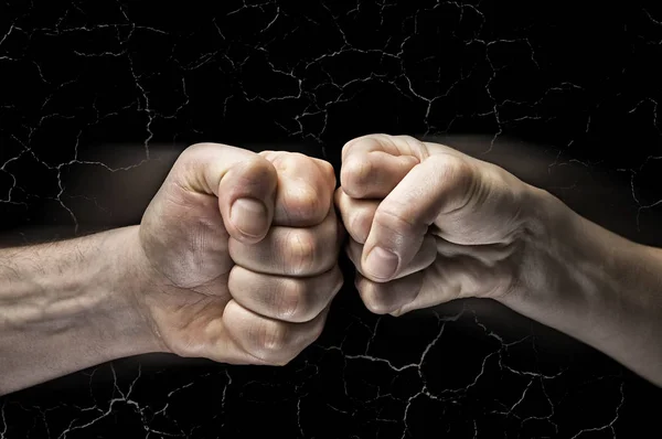 Clash of two fists with cracks — Stock Photo, Image