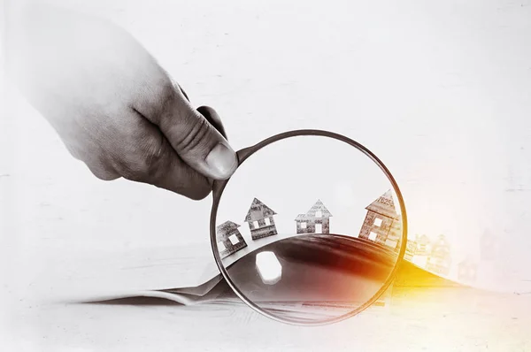 Paper house under a magnifying lens — Stock Photo, Image