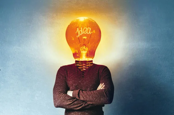 Concept of a new idea. A man with an incandescent lamp instead of a head.