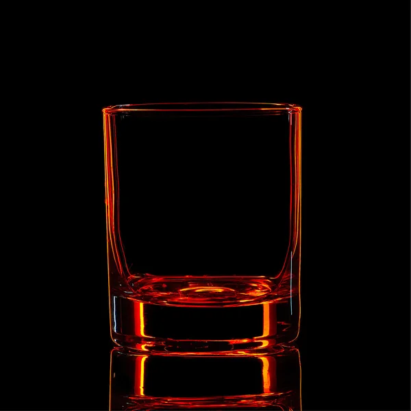 Silueta de vidrio rojo fuerte de licor en negro — Foto de Stock