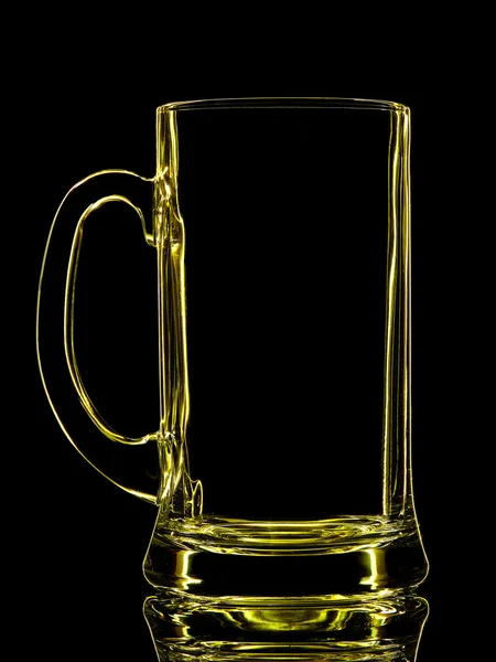 Silhouette of yellow beer glass on black — Stock Photo, Image