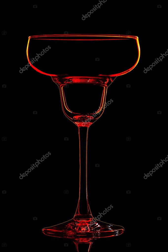 Silhouette of red margarita glass with clipping path on black background.