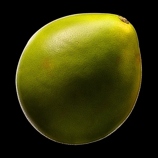 Green pomelo fruit isolated on black background — Stock fotografie