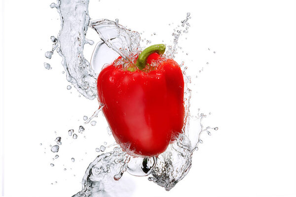 Water splash with bell pepper isolated