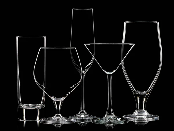 Silhouette of different glasses on black background — Stock Photo, Image