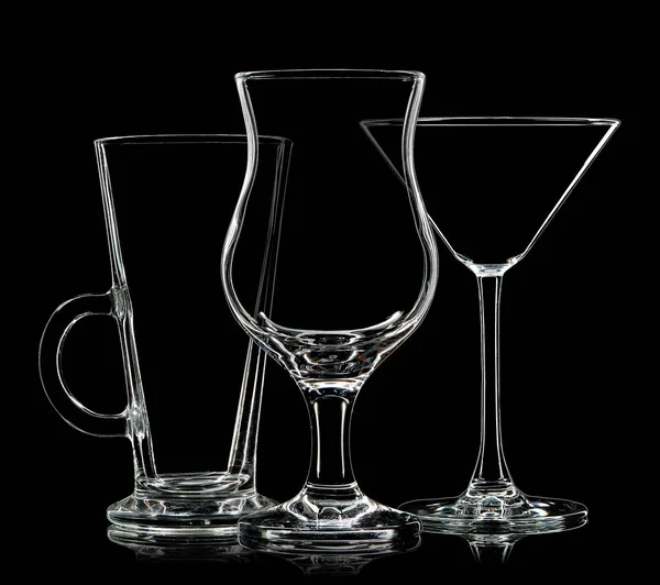 Silhouette of different glasses on black background — Stock Photo, Image