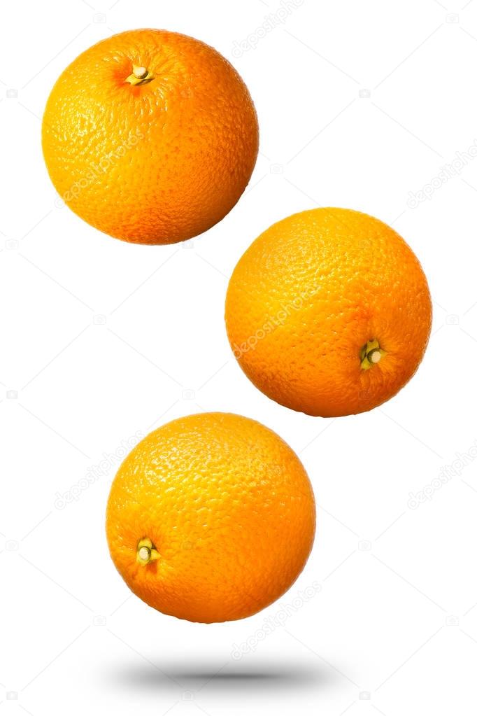 Falling oranges fruit isolated on white background