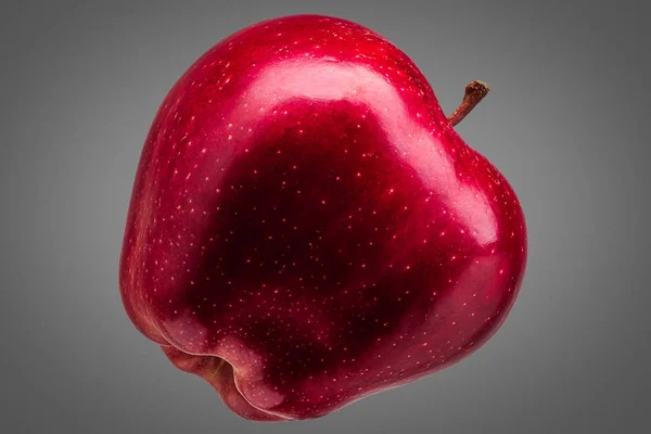 Pomme rouge unique délicieux sur fond gris — Photo