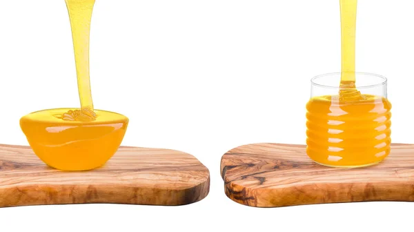 Conjunto de frascos de mel em prancha de madeira isolada em branco — Fotografia de Stock